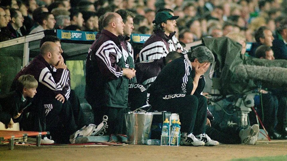 Kevin Keegan, with his head in his hands, sits in front of the rest of Newcastle's bench