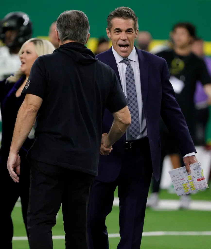 ESPN broadcaster Chris Fowler (right) greets Utah head coach Kyle Whittingham before the Utes win over Oregon in the Pac-12 Conference championship game at Allegiant Stadium on Dec. 3, 2021 in Las Vegas. Getty Images