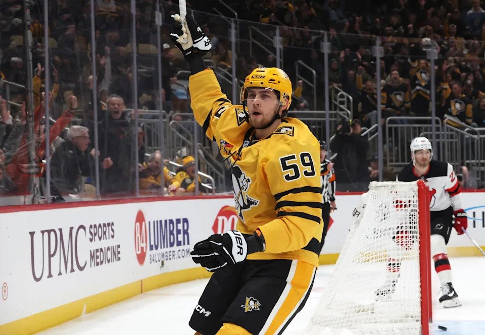 Feb 26, 2026; Pittsburgh, Pennsylvania, USA; Pittsburgh Penguins right wing Egor Chinakhov (59) reacts after scoring a goal against the New Jersey Devils during the third period at PPG Paints Arena. Mandatory Credit: Charles LeClaire-Imagn Images