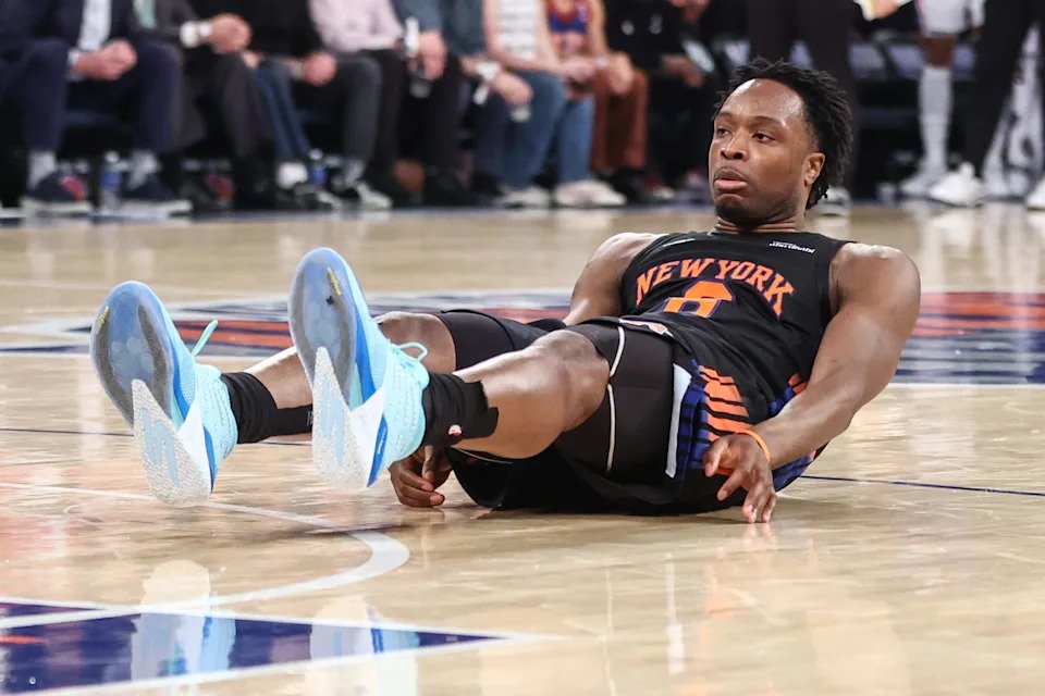 New York Knicks forward Og Anunoby (8) falls to the court after missing a shot against the Philadelphia 76ers.