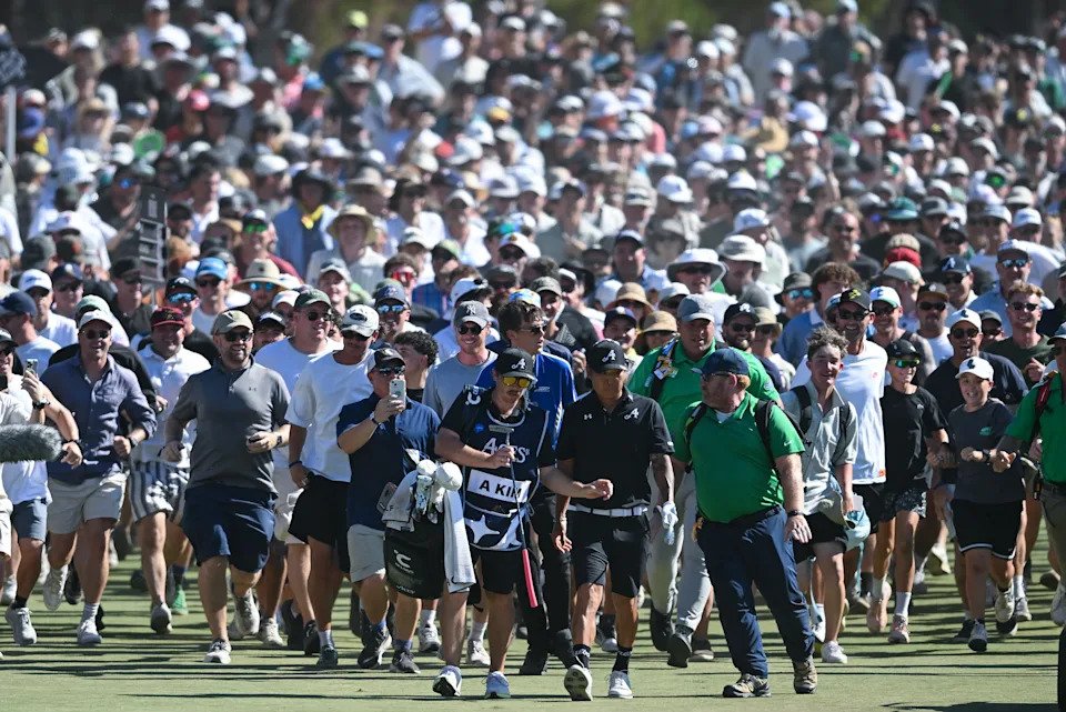 ADELAIDE, AUSTRALIA - FEBRUARY 15: Anthony Kim of the Aces heads down the 18th and is over run by the crowd during day four of LIV Adelaide at The Grange Golf Club on February 15, 2026 in Adelaide, Australia. (Photo by Mark Brake/Getty Images)