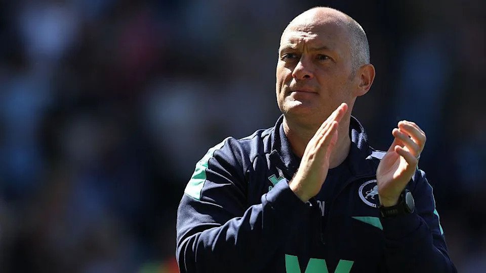 Alex Neil applauds the Millwall fans