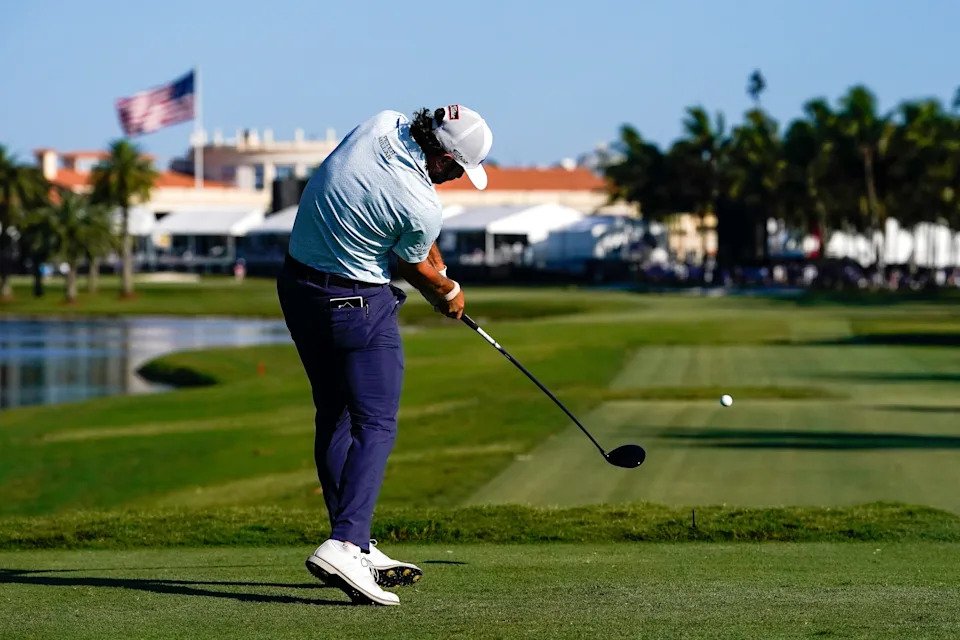 May 2, 2026; Miami, Florida, USA; Cameron Young plays his tee shot on the 18th hole during the third round of the Cadillac Championship golf tournament. Mandatory Credit: Jeff Romance-Imagn Images