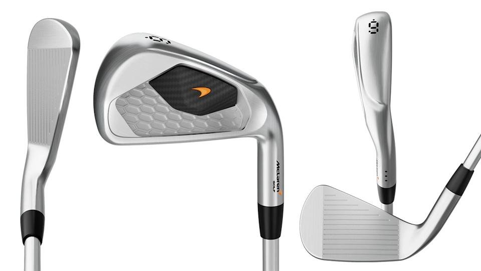 Three silver golf irons are shown from different angles, highlighting the clubface grooves, sleek back design with a black and orange insert, and the clubs polished finish.