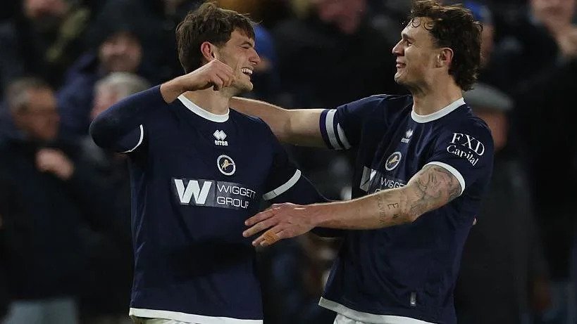 Caleb Taylor and Jake Cooper go to hug after Taylor scores for Millwall